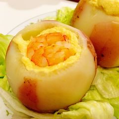 A picture of Savory steamed egg custard with shrimp in radish cup.