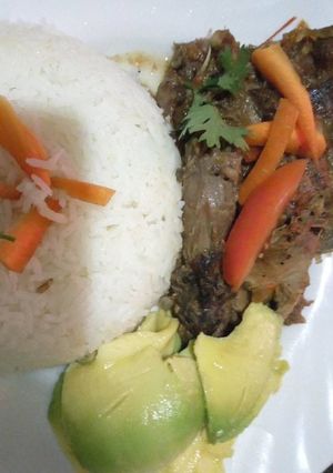 A picture of Kienyeji chicken stew with stir fried rice.