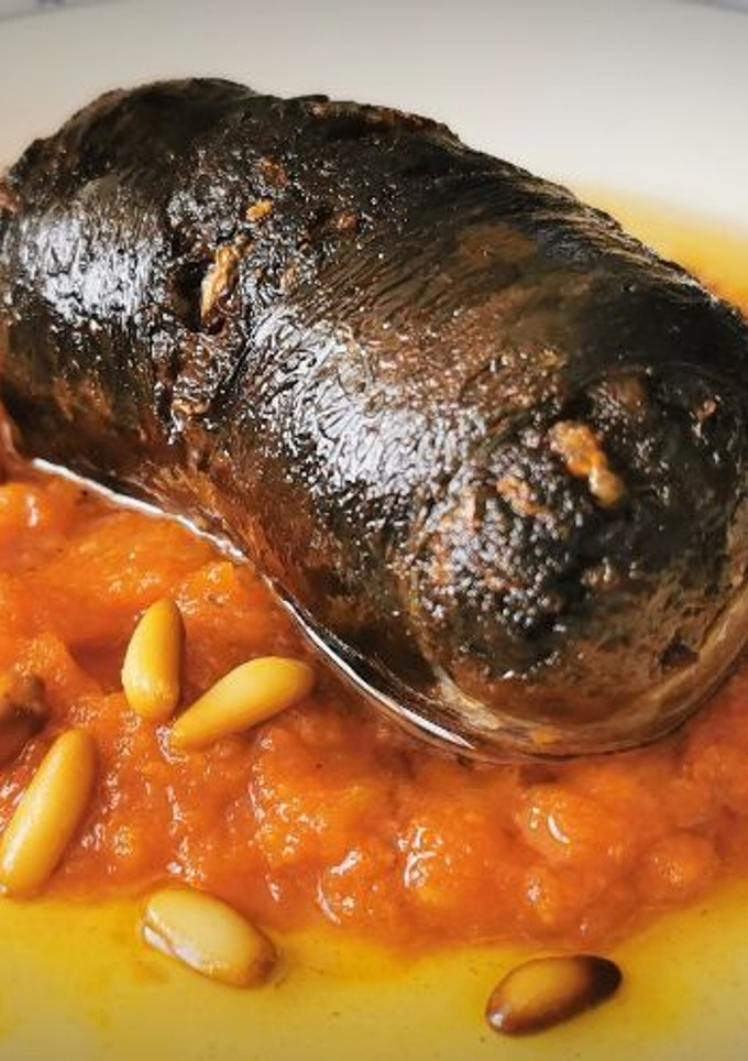 Una foto de Tapa de Morcilla de Cebolla con Sofrito de Tomate casero