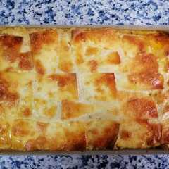 Una foto de Moussaka a cuatro manos