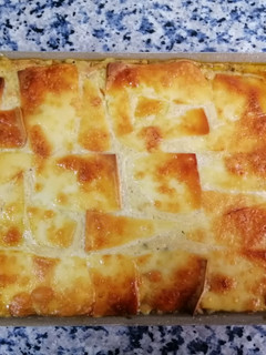 Una foto de Moussaka a cuatro manos