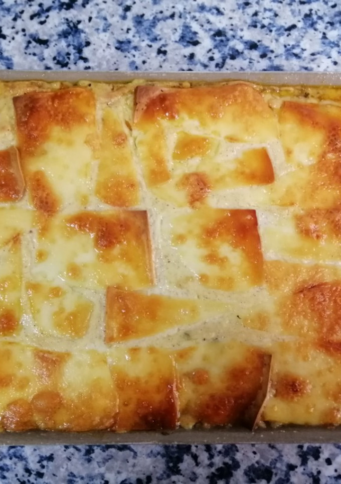 Una foto de Moussaka a cuatro manos