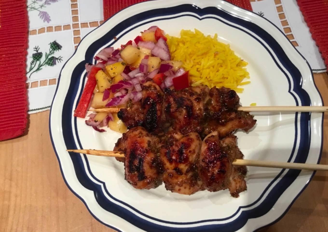 Sticky Chicken thigh skewers, rice and mango salsa