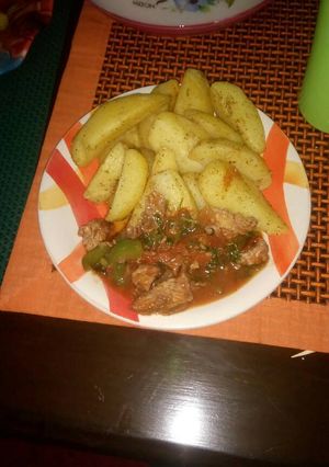 A picture of Spicy potato wedges.