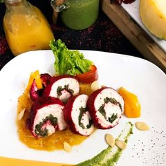 A picture of Sumac Chicken Roulade In Pumpkin Puree.