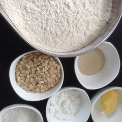 A picture of 100% whole wheat pumpkin seed bread with coconut powder for a twist - the bread machine way.