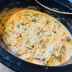 A picture of Creamy Chicken Orzo with Spinach and Artichokes.