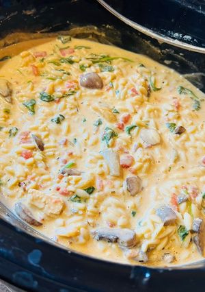 A picture of Creamy Chicken Orzo with Spinach and Artichokes.