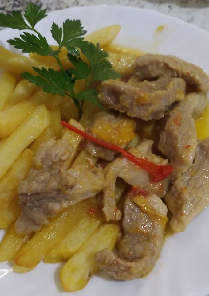 Una foto de Secreto ajillo y pimientos de colores