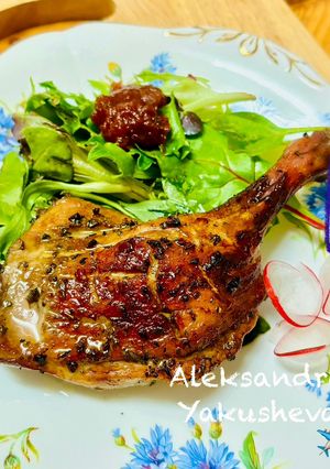 A picture of Duck legs in soy and honey sauce.
