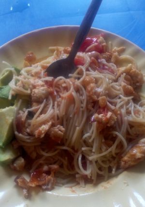 A picture of Sphaggetti with avocado and eggs.