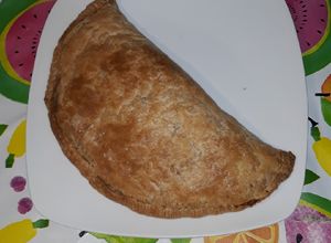 Foto principal de Calzone de espinacas, alga nori y queso rulo de cabra
