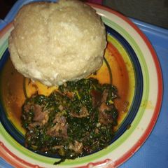 A picture of Eba with vegetable soup.