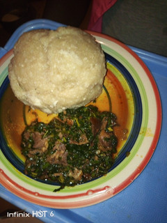 A picture of Eba with vegetable soup.