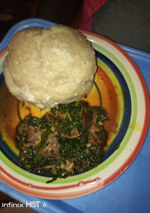 A picture of Eba with vegetable soup.