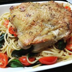 A picture of Herb Chicken sweet basil tomato spaghetti.