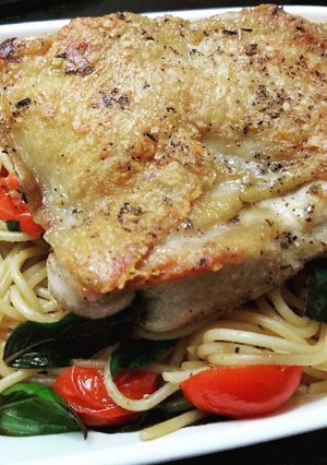 A picture of Herb Chicken sweet basil tomato spaghetti.