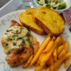 A picture of Grilled Chicken with mushroom sauce.