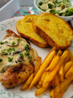 A picture of Grilled Chicken with mushroom sauce.