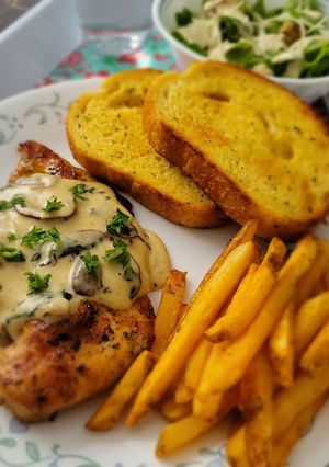 A picture of Grilled Chicken with mushroom sauce.