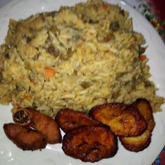 A picture of Coconut Rice, Fried Plantain with Fried Turkey.