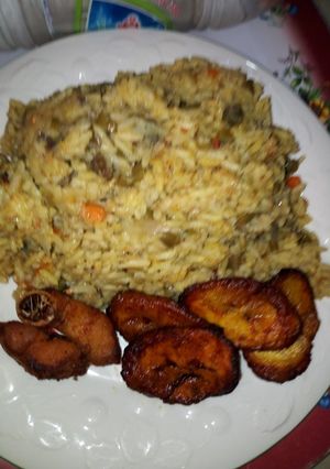 A picture of Coconut Rice, Fried Plantain with Fried Turkey.