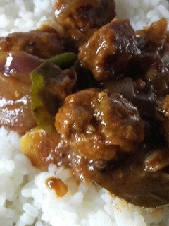 A picture of Meat balls gravy with rice.