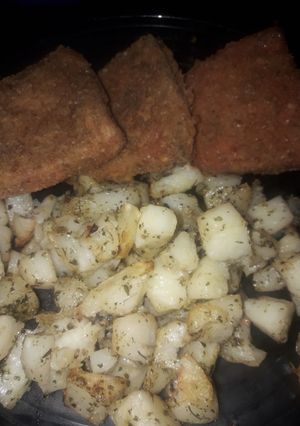Una foto de Milanesas de Mortadela con papas al horno