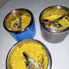 A picture of Turmeric concoction rice with fish.