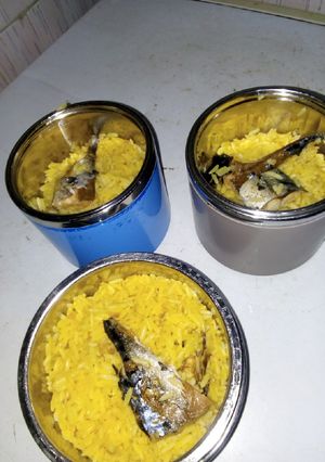 A picture of Turmeric concoction rice with fish.