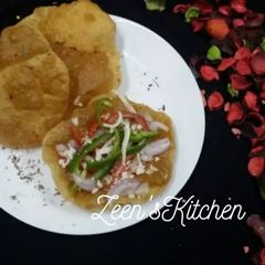 A picture of Poorizza (Whole Wheat Poori Pizza).