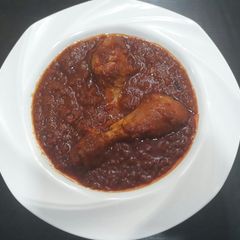 A picture of Chicken tomato stew.