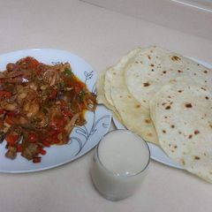 A picture of Khubus(bread)with chicken sauce.