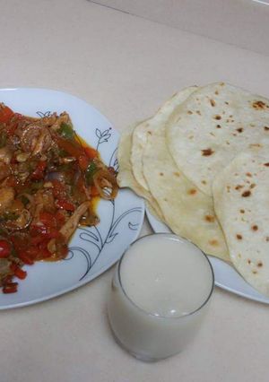A picture of Khubus(bread)with chicken sauce.