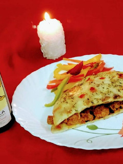 A picture of WINE ROASTED CHEESE BURST BBQ CHICKEN and NAAN SANDWICH.
