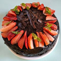 A picture of Eggless Layered chocolate strawberry orange cake.