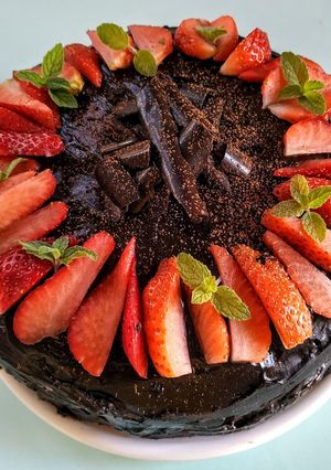 A picture of Eggless Layered chocolate strawberry orange cake.