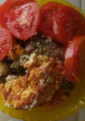 A picture of Egg rice with beans.