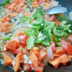A picture of Tri colour saucey vegetable salad.