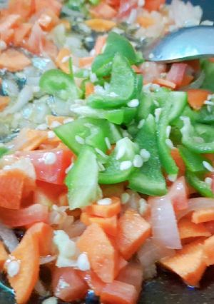 A picture of Tri colour saucey vegetable salad.