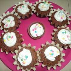 A picture of Chocolate Velvet Cupcake with whipping cream frosting.