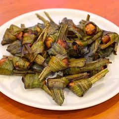 A picture of Chicken wrapped in fragrant pandanus leaves. (Pandan Chicken).