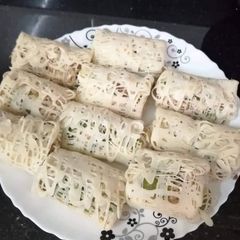 A picture of Malaysian net crepes with Indian stuffed chicken.