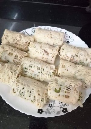 A picture of Malaysian net crepes with Indian stuffed chicken.