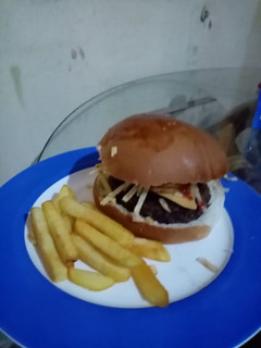 Una foto de Hamburguesa norteamericana angus beef a la parrilla