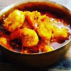 A picture of Chingri macher malai curry.