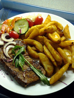 A picture of Chargrilled Steak & Spicy Wedges.