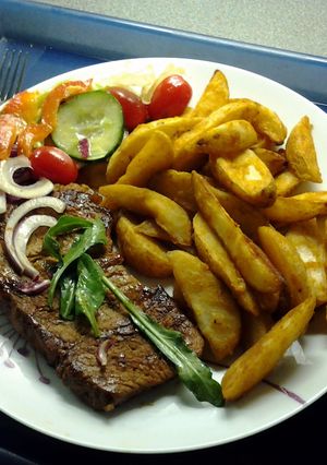 A picture of Chargrilled Steak & Spicy Wedges.