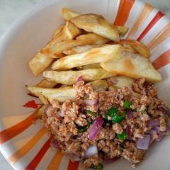 A picture of Sweet potatoes with egg sauce.