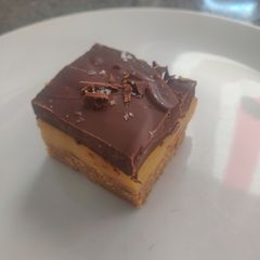 A picture of Dark Chocolate Millionaire Biscuit Squares.